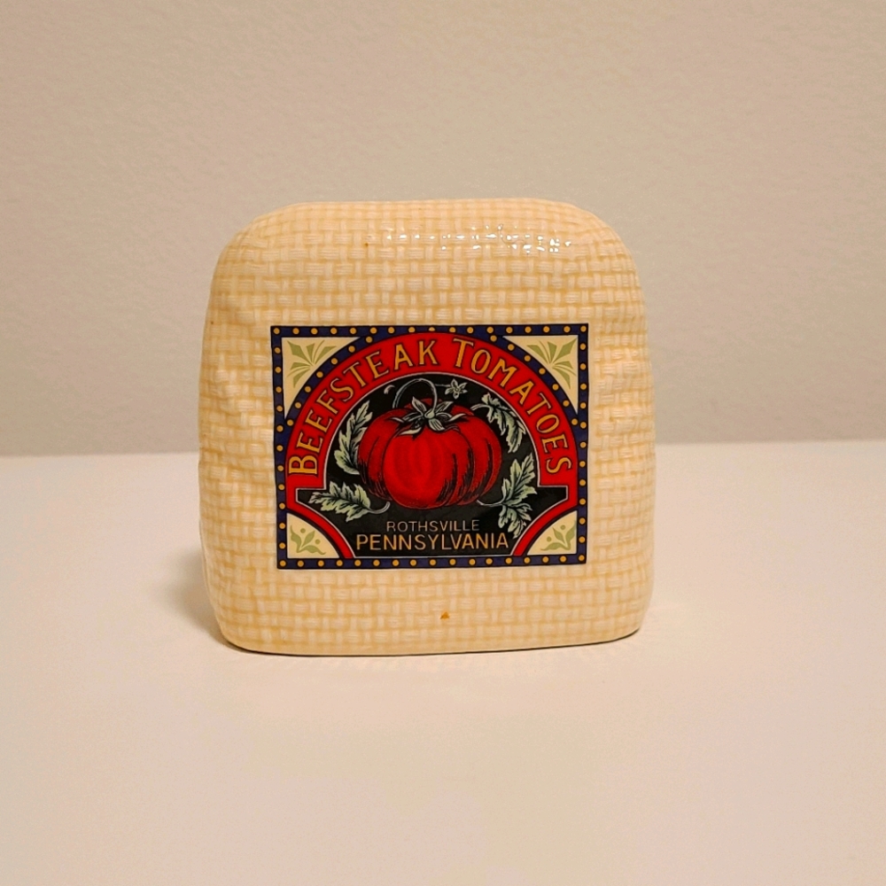 Beefsteak and tomato napkin holded